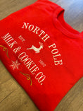 Load image into Gallery viewer, North Pole Milk & Cookie Co. Christmas Sweatshirt
